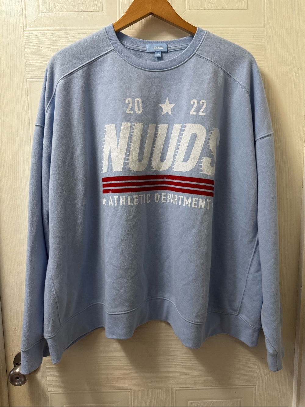 nuuds Light Blue Crewneck Sweatshirt with White Logo and Red Stripes